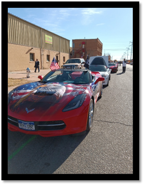 A red sports car parked on a street

AI-generated content may be incorrect.