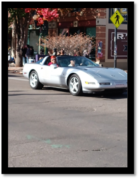 A silver convertible car on the street

AI-generated content may be incorrect.