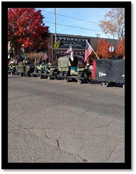 A row of military vehicles on a street

AI-generated content may be incorrect.