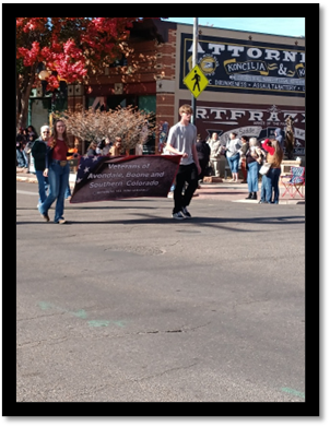 A group of people walking in a street

AI-generated content may be incorrect.