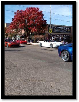A group of cars parked on the side of a road

AI-generated content may be incorrect.