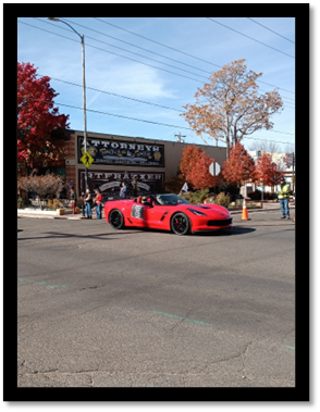 A red sports car parked on the side of a road

AI-generated content may be incorrect.