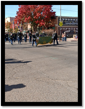 A group of people marching in a parade

AI-generated content may be incorrect.