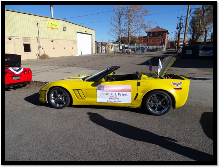 A yellow convertible car with the hood open

Description automatically generated