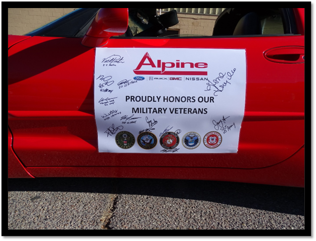 A sign on a red car

Description automatically generated
