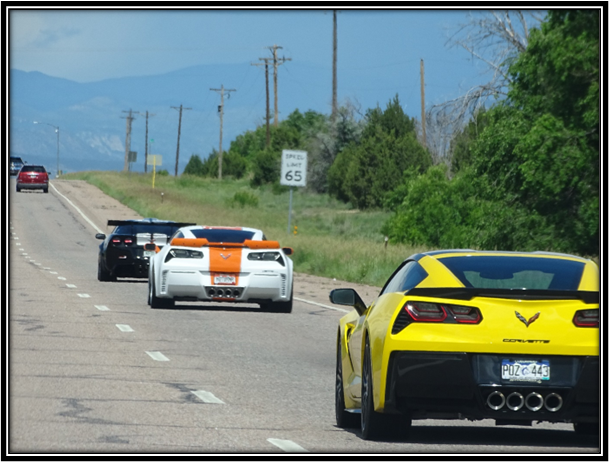 A group of cars driving on a road

Description automatically generated with low confidence